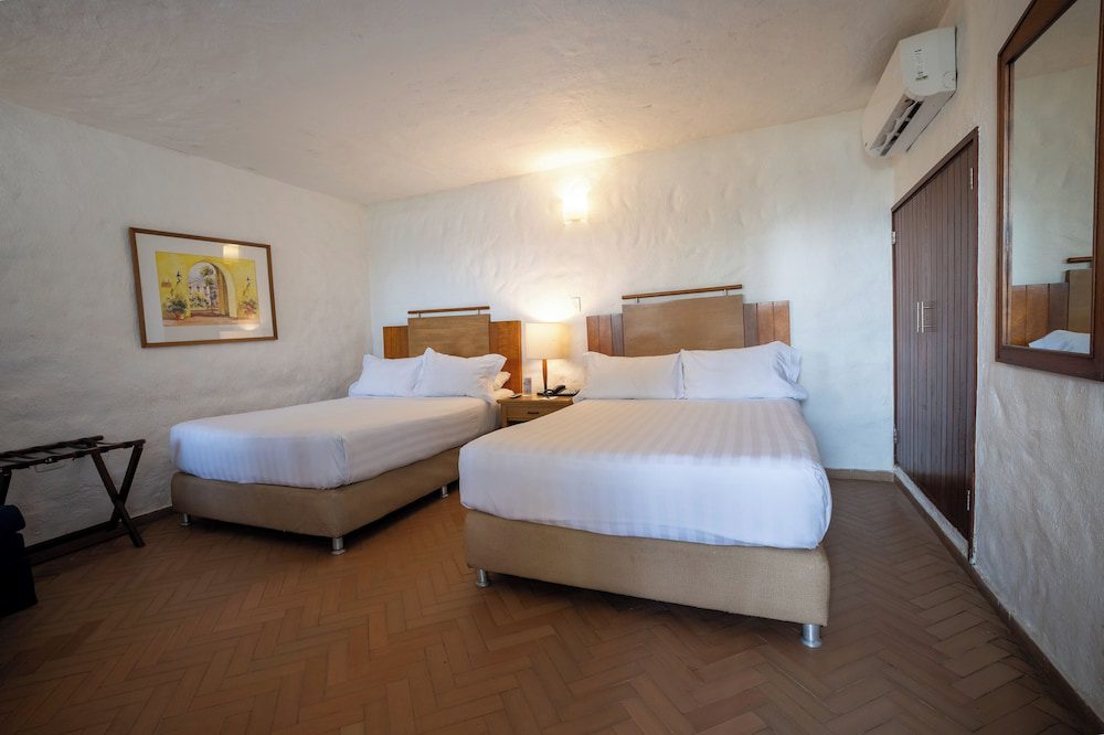 Estelar Santamar Hotel & Centro de Convenciones en Santa Marta: habitación con camas dobles