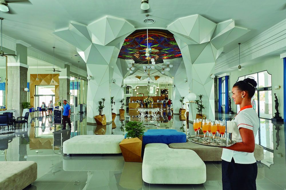 Hotel Riu Palace Punta Cana: sala de estar en el lobby